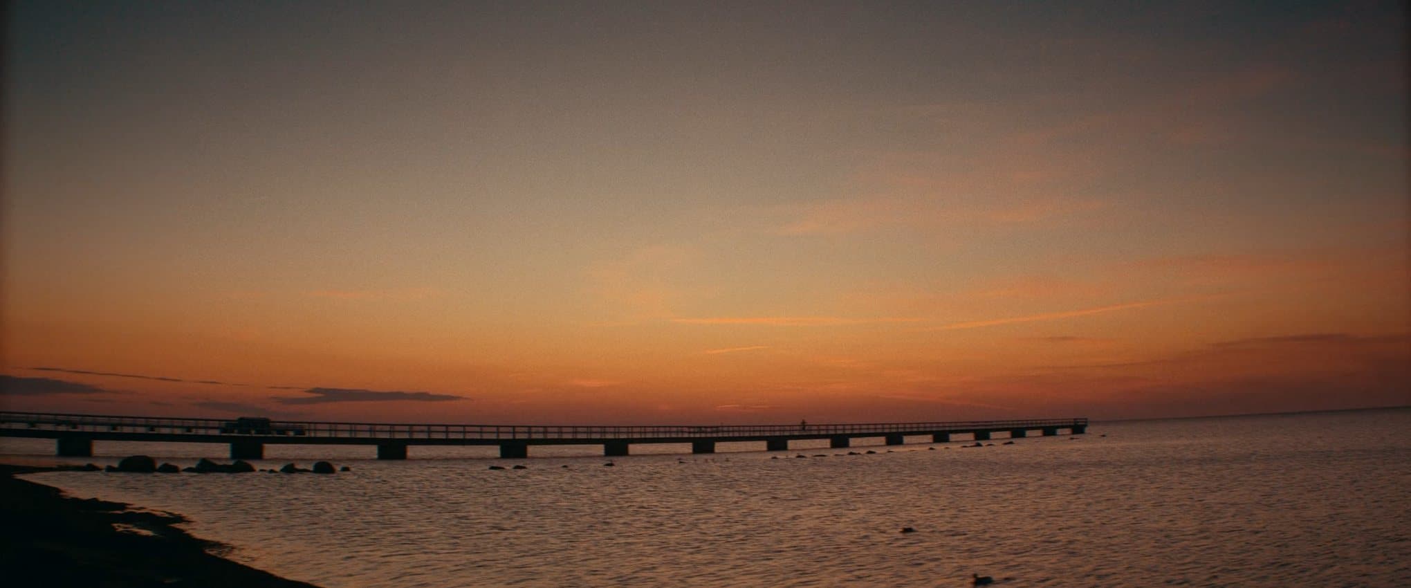 A jetty at sunset, a frame from the commercial Forever Faster for Puma.